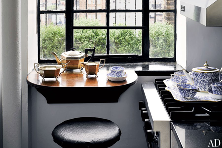 A tea service that once belonged to Queen Victoria rests on the kitchen's Viking range.